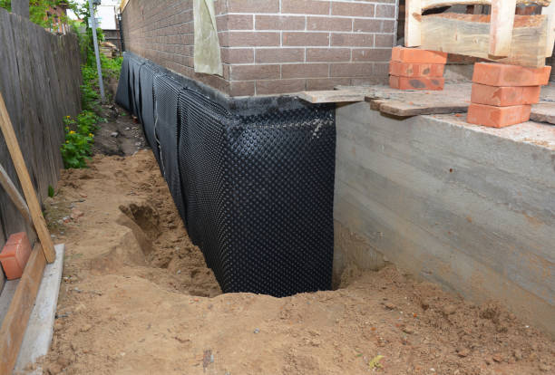 SJ Waterproofing Pros technician performing targeted Emergency Waterproofing assessment in Pemberville, OH